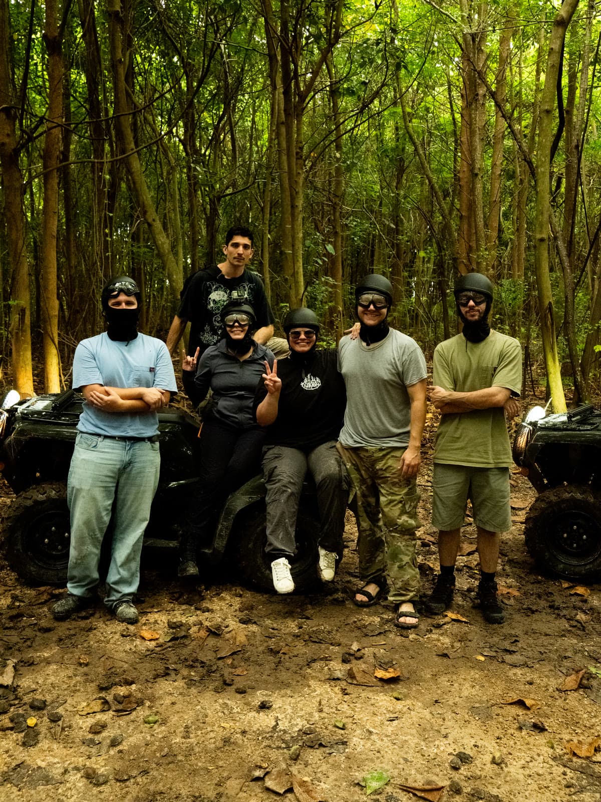 A group and their ATVs among the trees before a ride